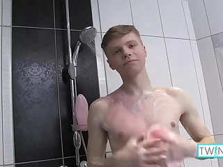 Watch James, a horny twink, indulge in a steamy shower session with his big dick and perky nipples: Bathroom Gay Videos